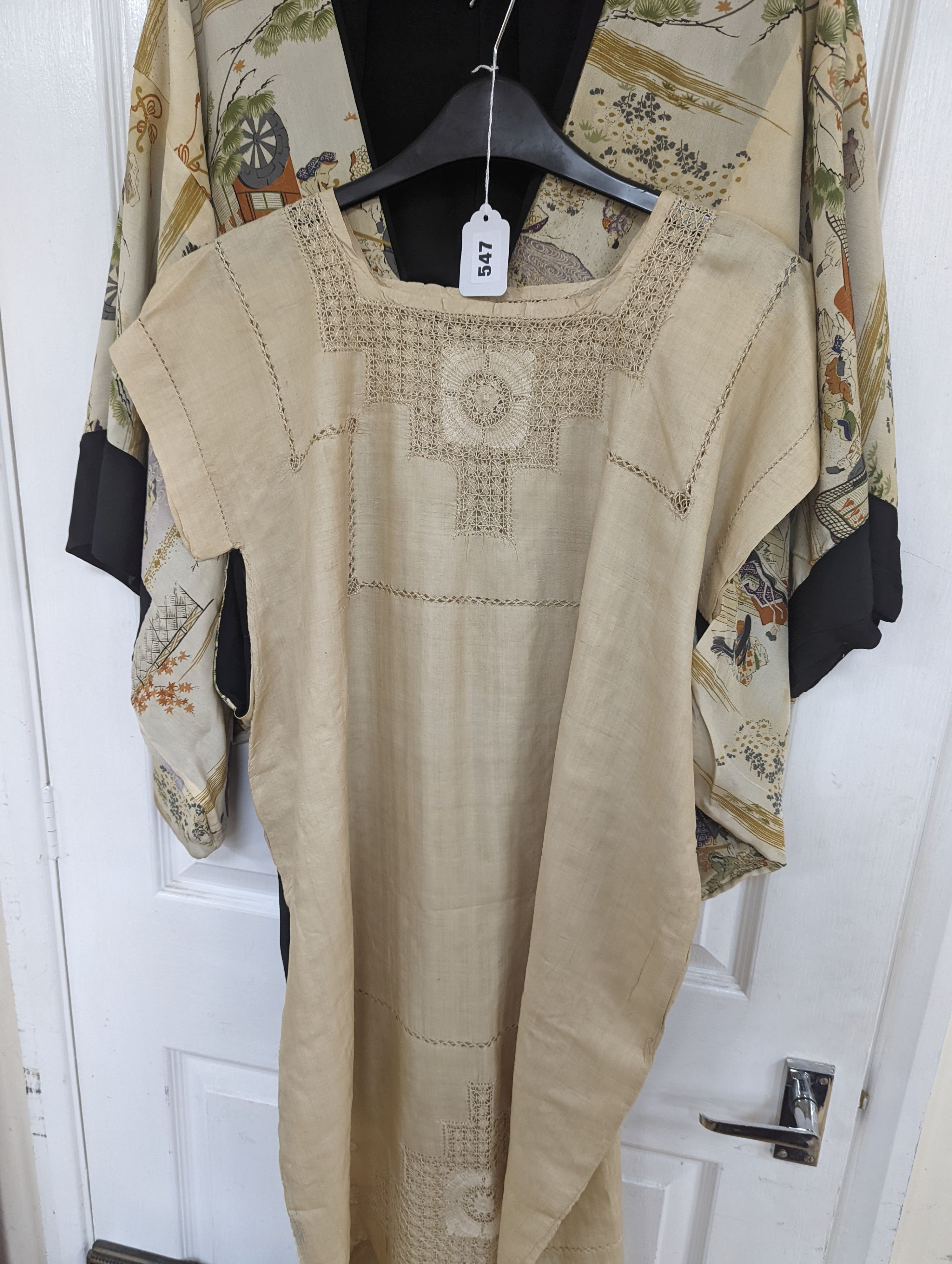 A 1920's Chinese dragon embroidered waistcoat, a cream silk drawn thread dress and a silk crepe black and patterned reversible kimono (3 items).